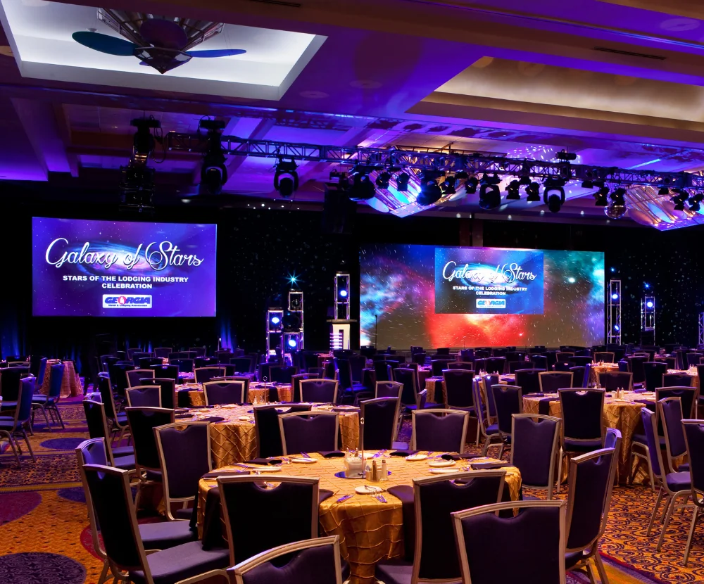 Event room with screens and tables at the courtland grand